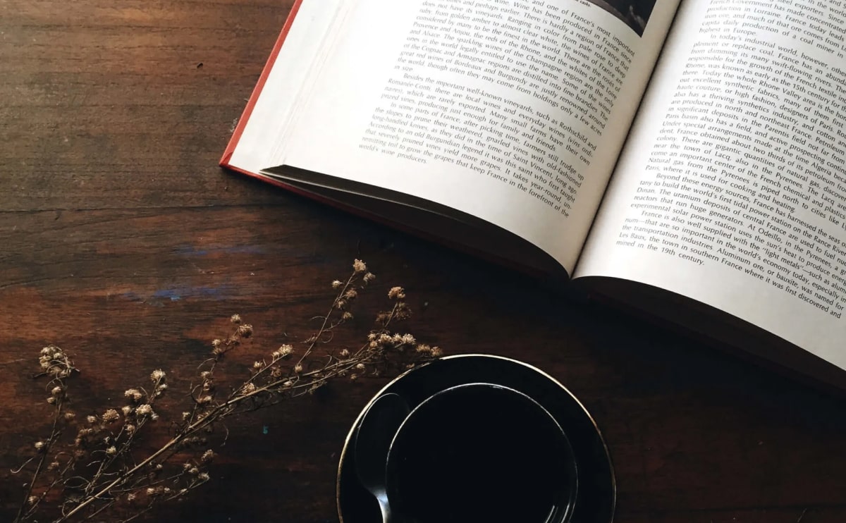 Open book on desk symbolizing Digital Shop Era